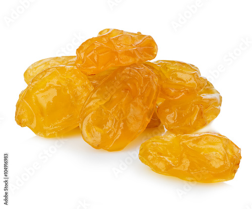 Yellow raisins close-up isolated on a white background.