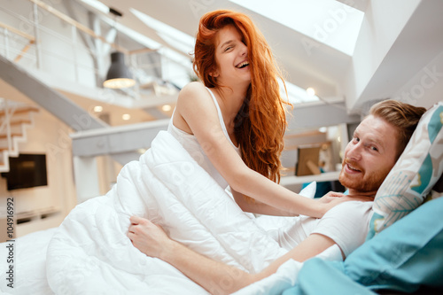 Romantic couple in love lying on bed