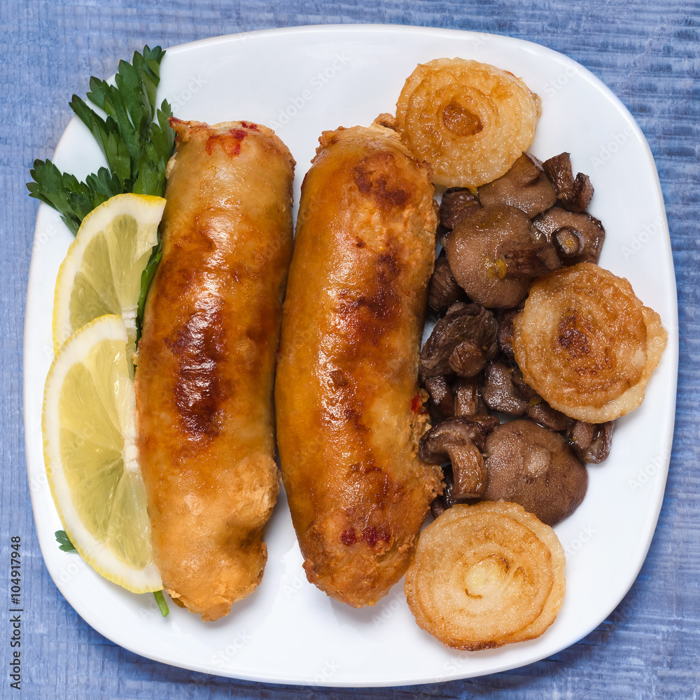Fried sausage with mushrooms and onions. Fried sausage with mushrooms and onions.