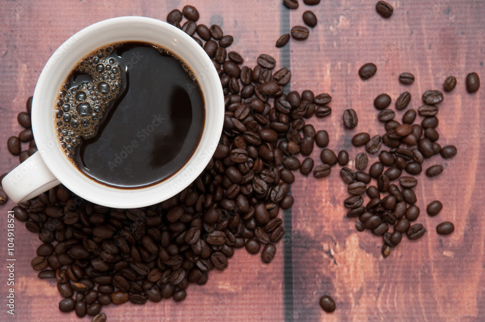 Naklejka premium coffee beans in a mug