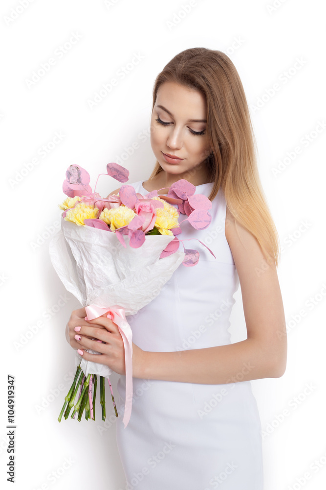 Young cute woman with spring flower bouquet