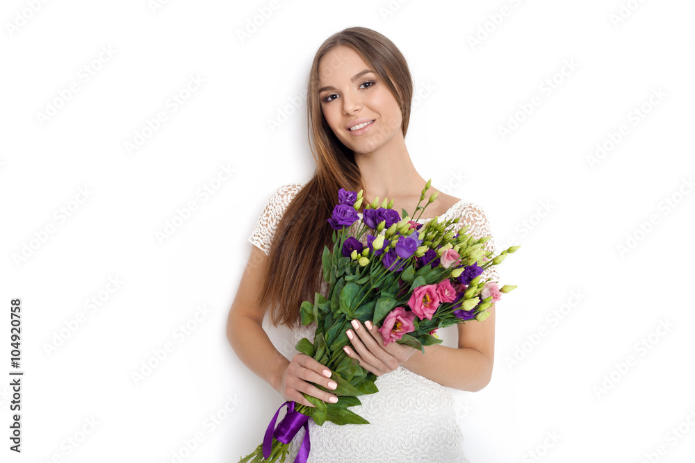 Young cute woman holding bunch of flowers Young cute woman holding bunch of flowers