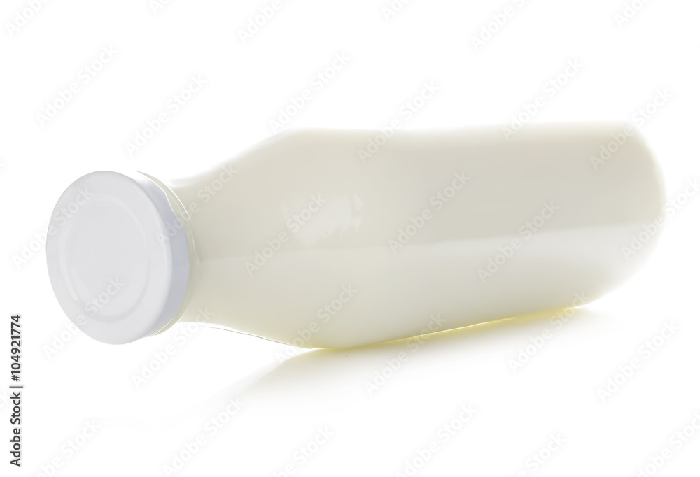 Bottle of milk close-up isolated on white background. Bottle of milk close-up isolated on white background.