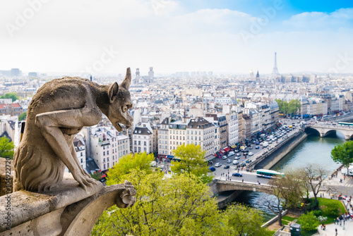 Chimera of Notre Dame Cathedral in Paris, France. Focus on statue