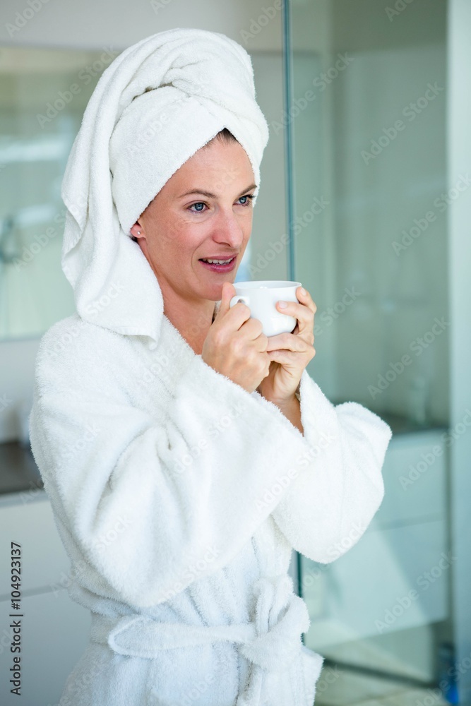 woman wearing a dressing gown smiling at the camera woman wearing a dressing gown smiling at the camera