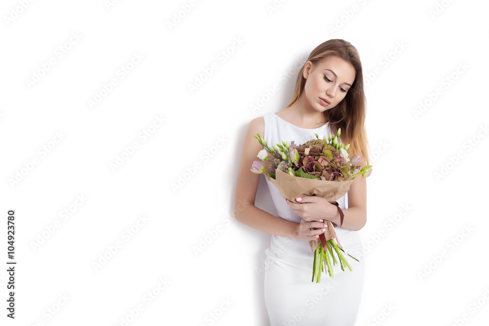 Young cute woman holding bunch of flowers Young cute woman holding bunch of flowers