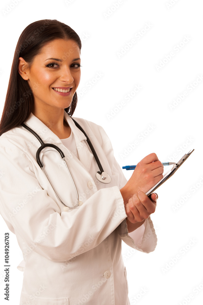 Woman doctor with stethoscope around neck writing diagnose on cl Woman doctor with stethoscope around neck writing diagnose on cl