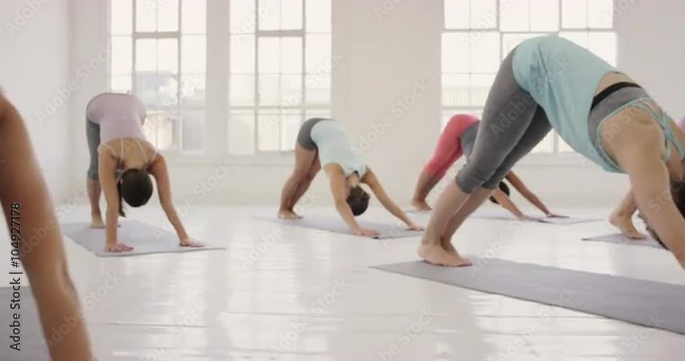 Yoga class multi racial group of women exercising fitness healthy lifestyle