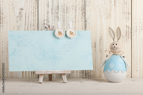 Easter bunny and blank card for holiday greeting