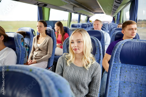 group of passengers or tourists in travel bus © Syda Productions