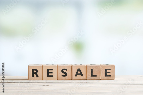 Resale sign on a wooden desk