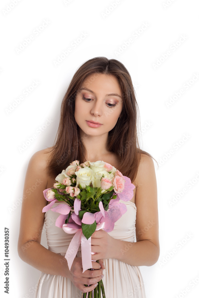 Young cute woman holding bunch of flowers Young cute woman holding bunch of flowers