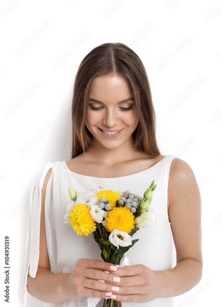 Young cute woman holding bunch of flowers Young cute woman holding bunch of flowers