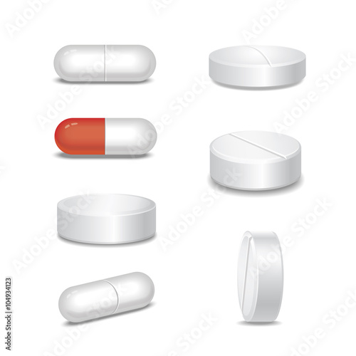 Set of  medical pills in different positions isolated on white 