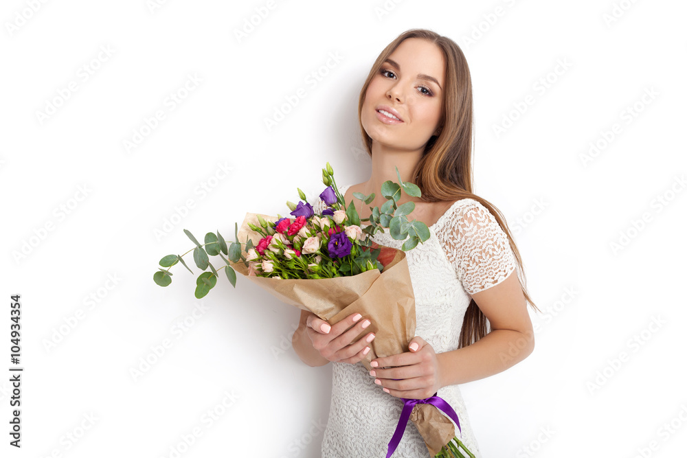 Young cute woman holding bunch of flowers Young cute woman holding bunch of flowers
