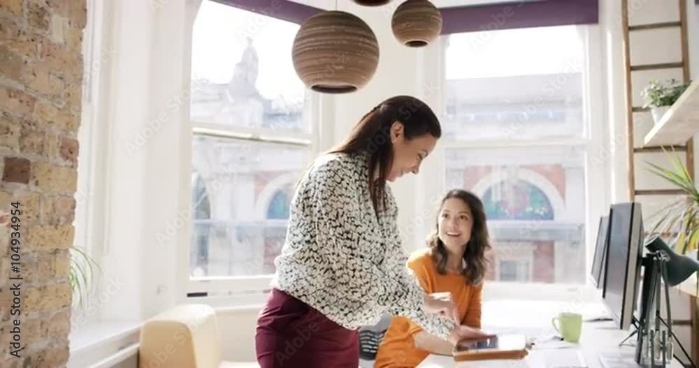 Business woman using tablet app showing 3d printed model of geodesic dome walking through modern office to diverse team meeting