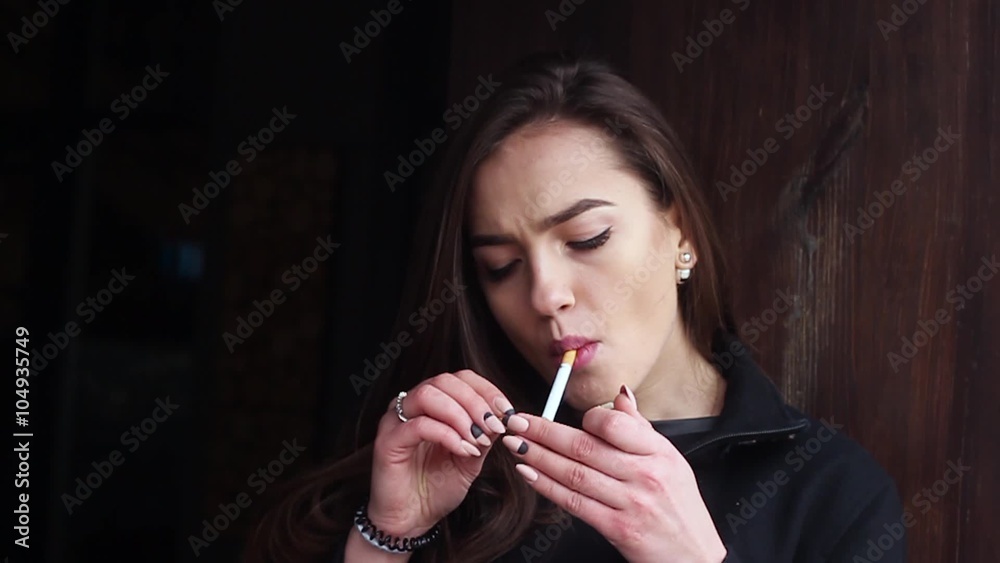 beautiful woman smoking cigarettes video Beautiful Woman Smokes a Cigarette in a Restaurant. Slow Motion