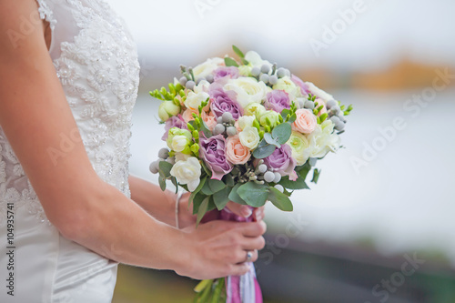 Bride with wedding bouket photo