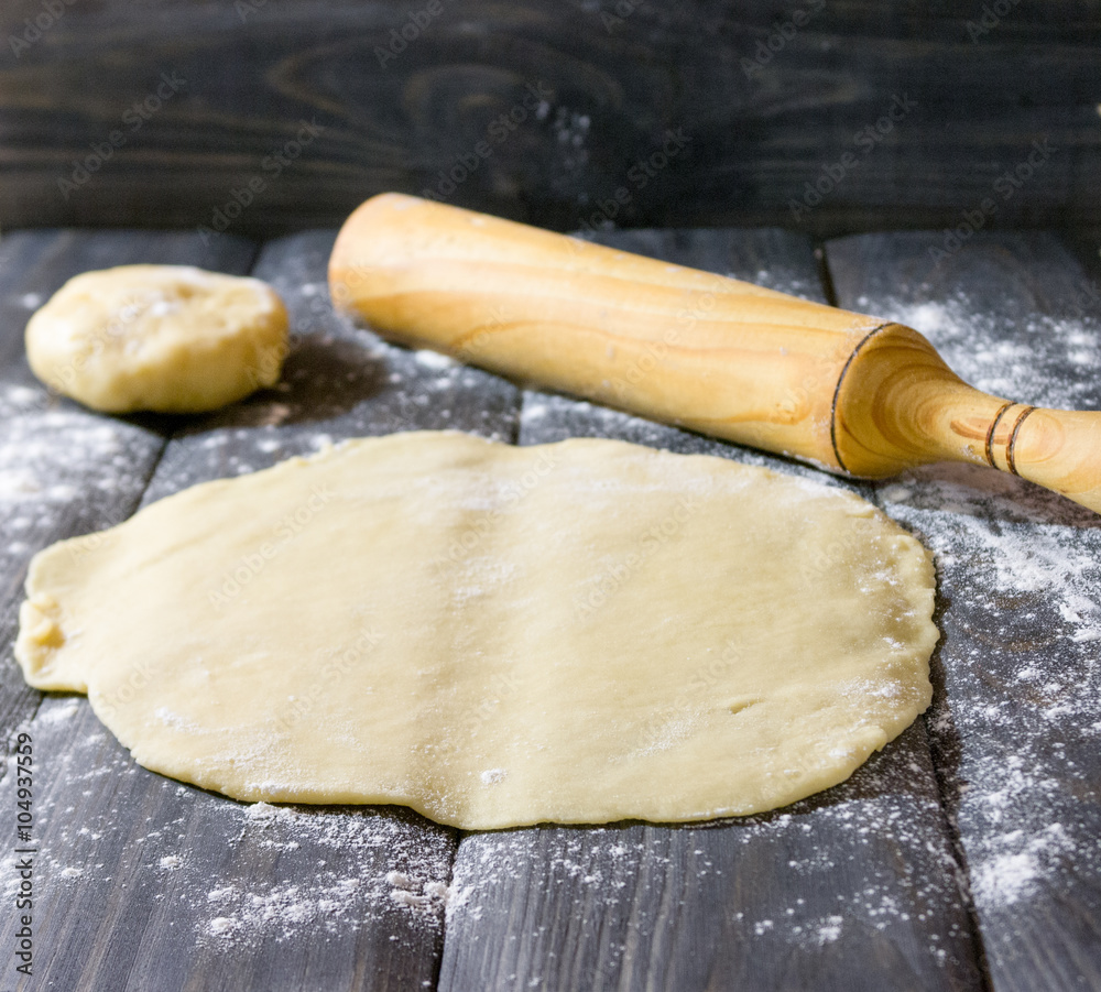 The rolling dough for a cake Napoleon