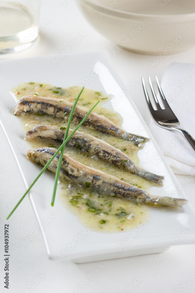 Marinated anchovies with garlic, parsley and olive oil. Marinated anchovies with garlic, parsley and olive oil.