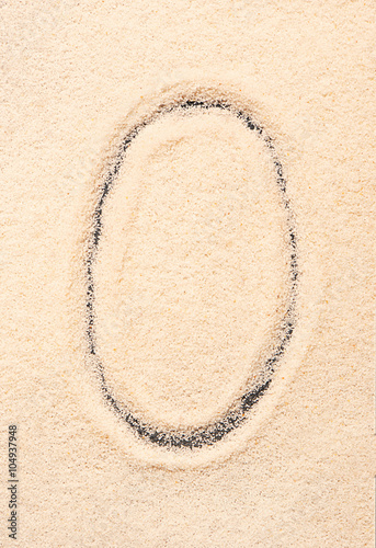 O letter written on sand