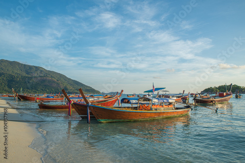 Long tail boats with sunrise sky in Koh Lipe Island