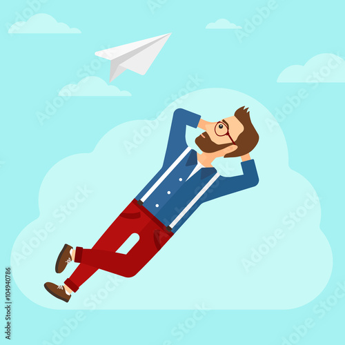 Businessman relaxing on cloud.