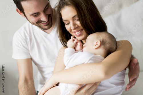 Happy family with newborn baby