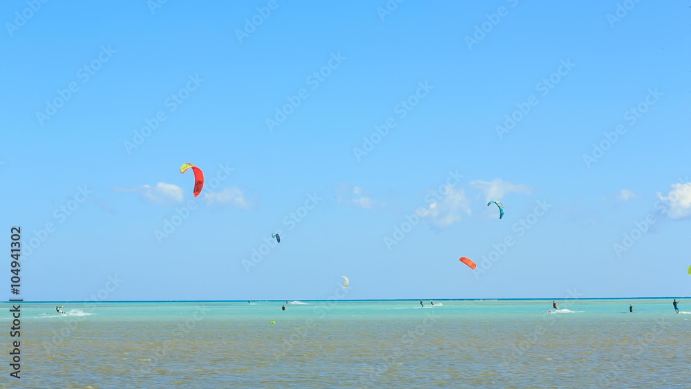 People engaged in kite surfing in the Kite Village at the Red Sea near Hamata Marine. People engaged in kite surfing in the Kite Village at the Red Sea near Hamata Marine.