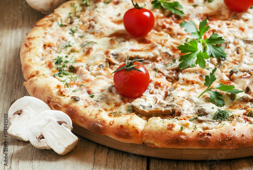 Pizza with chicken meat and mushrooms, selective focus