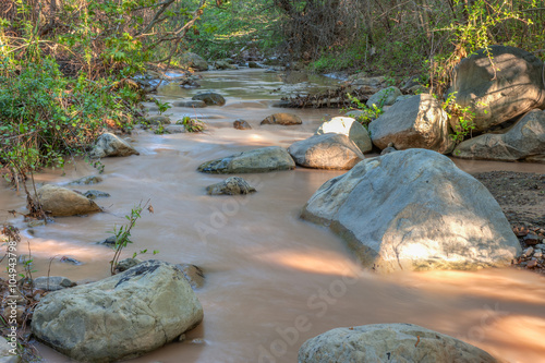 Canvas-taulu Landscape view of Santa Paula Creek with running water.