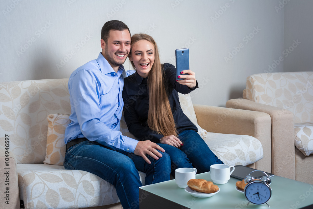 Beautiful young man and woman doing selfie with telephone camera Beautiful young man and woman doing selfie with telephone camera