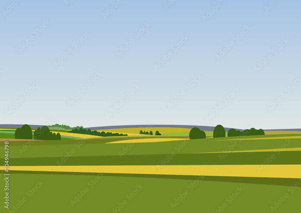Obraz premium Green landscape with yellow fields.