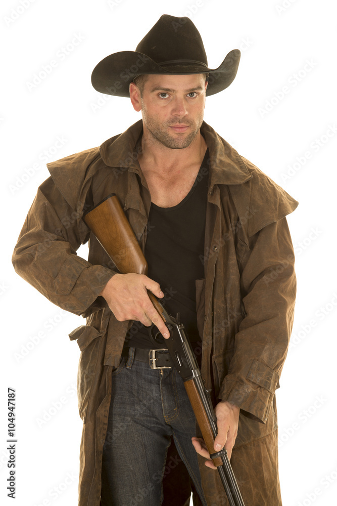 cowboy in black hat and duster hold rifle look cowboy in black hat and duster hold rifle look