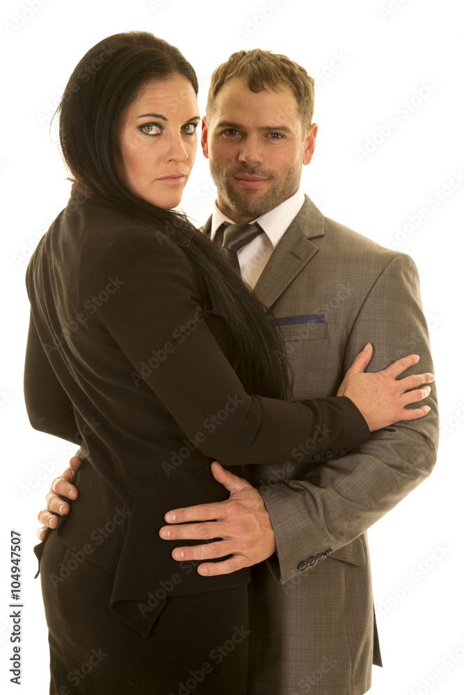 dressed up couple arms around each other looking dressed up couple arms around each other looking