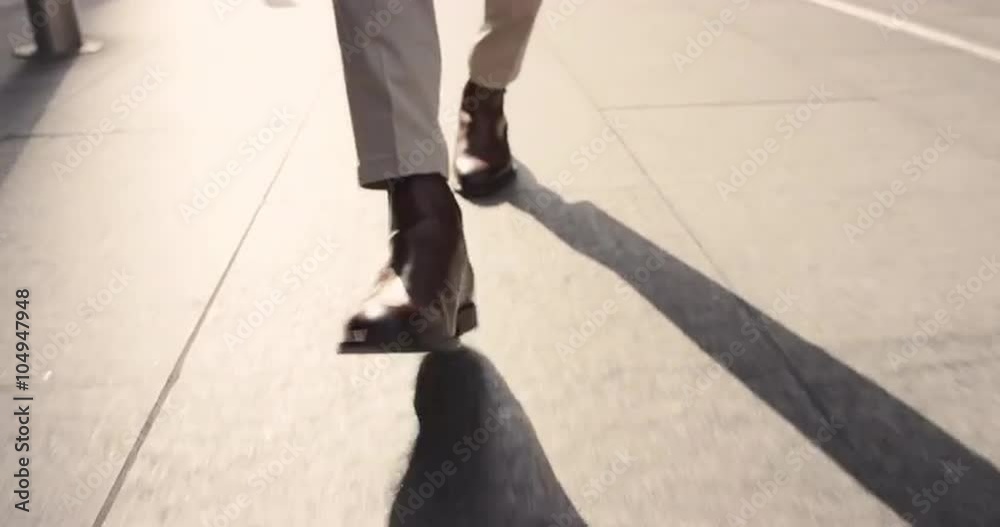 Close crop of businessman feet walking in city Close crop of businessman feet walking in city