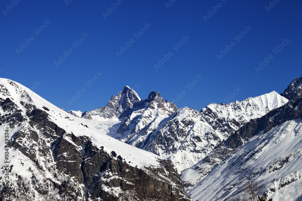 Mountain peaks in winter at sunny day
