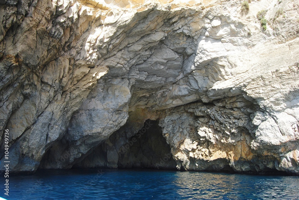 Entrance to the Cat's Cave in sea cliffs near the Blue Grotto in Malta.