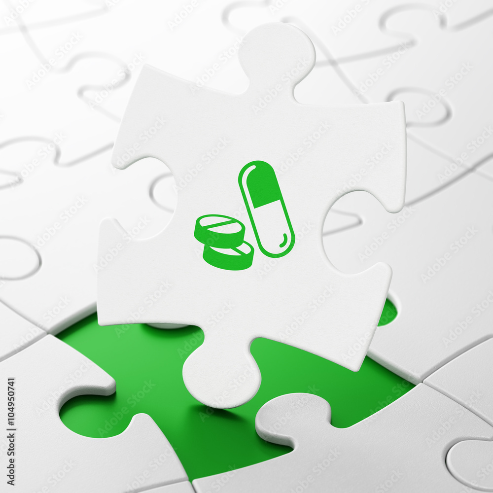 Medicine concept: Pills on puzzle background Medicine concept: Pills on puzzle background