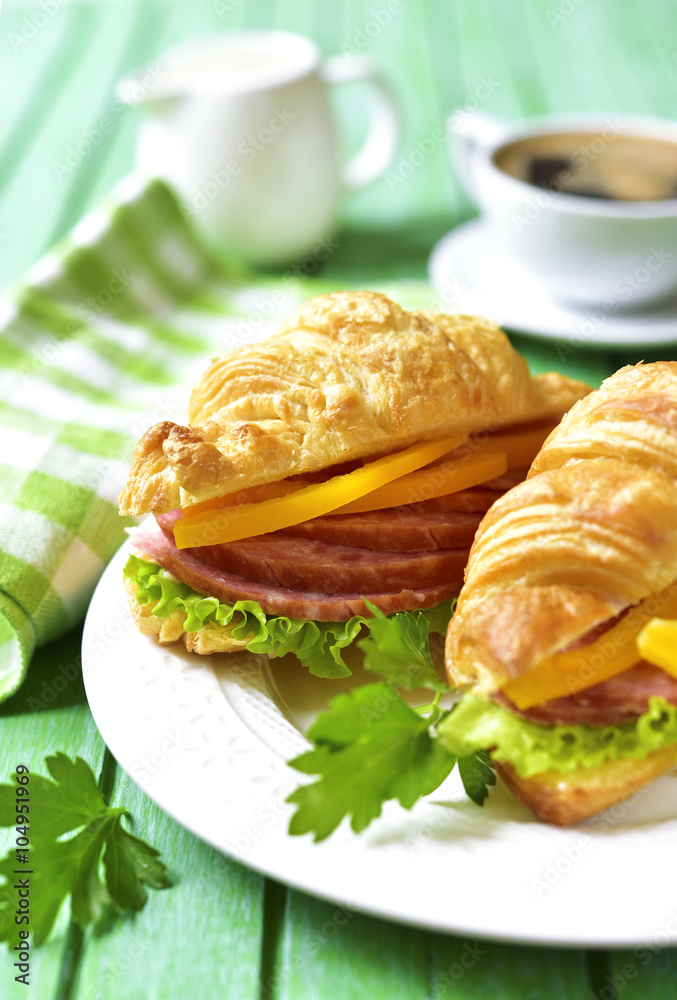 Croissant sandwich with salami and bell pepper. Croissant sandwich with salami and bell pepper.
