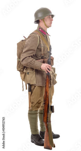  young Soviet soldier with rifle on the white background