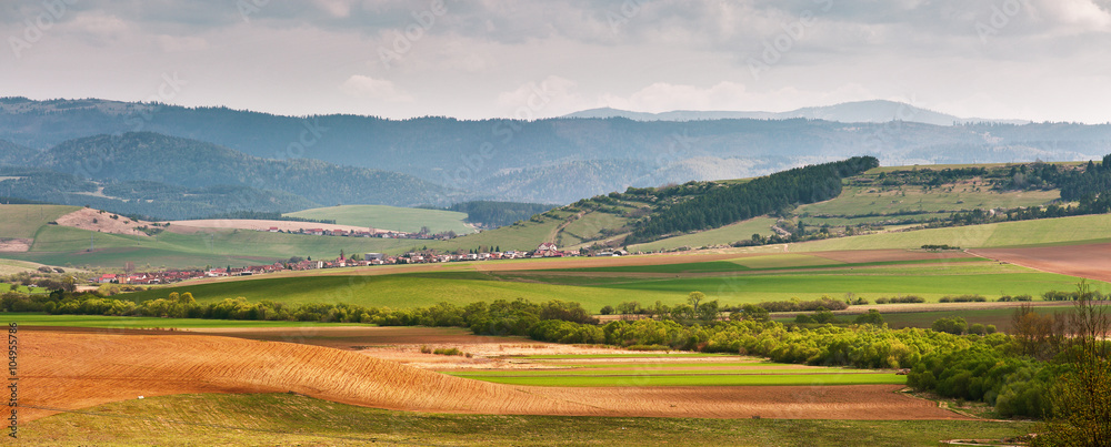 Obraz premium Green spring hills in Slovakia. April sunny countryside panorama