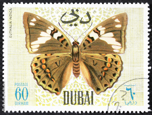 DUBAI - CIRCA 1968: A stamp printed by Dubai, shows Butterflyv, Circa 1968 photo