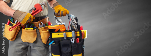 Фотография Builder handyman with construction tools.