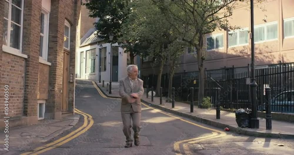 Contemporary funky elderly man street dancer dancing freestyle in the city Contemporary funky elderly man street dancer dancing freestyle in the city