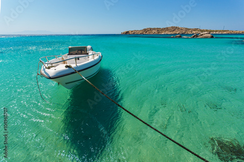 Small boat in Paranga Beach on the island of Mykonos, Cyclades, Greece
