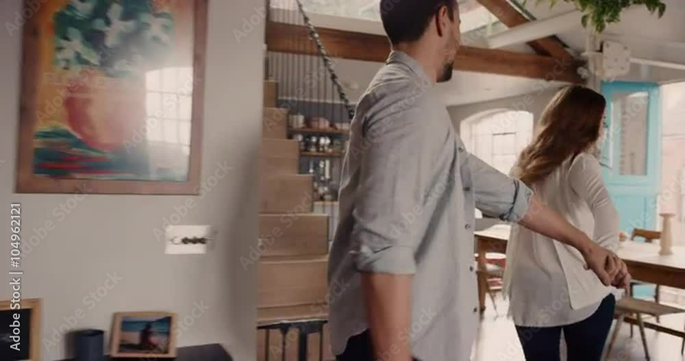 Excited Young couple exploring new home together