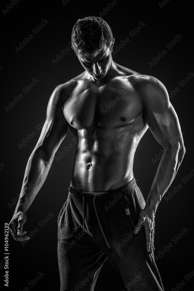 Sporty healthy man posing and showing his perfect boddy