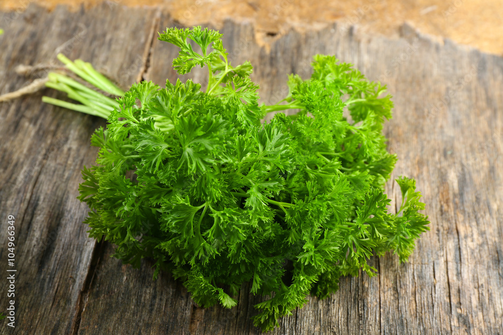Fresh parsley on wooden background Fresh parsley on wooden background