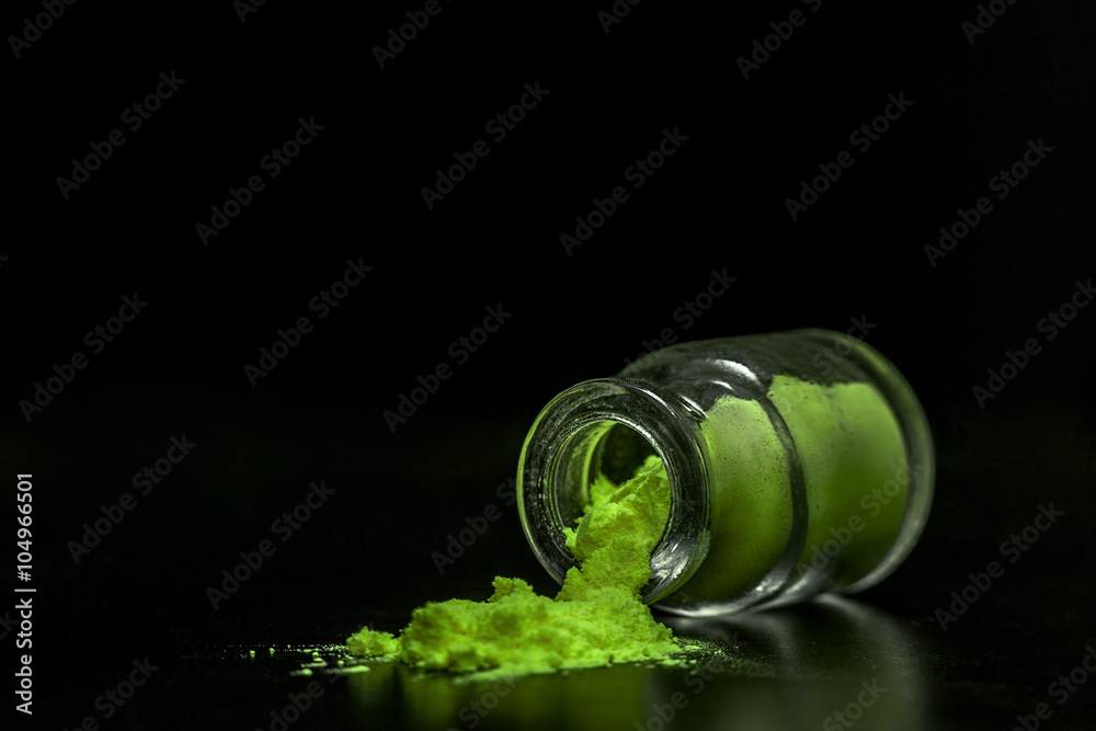 green colorant powder in the jar